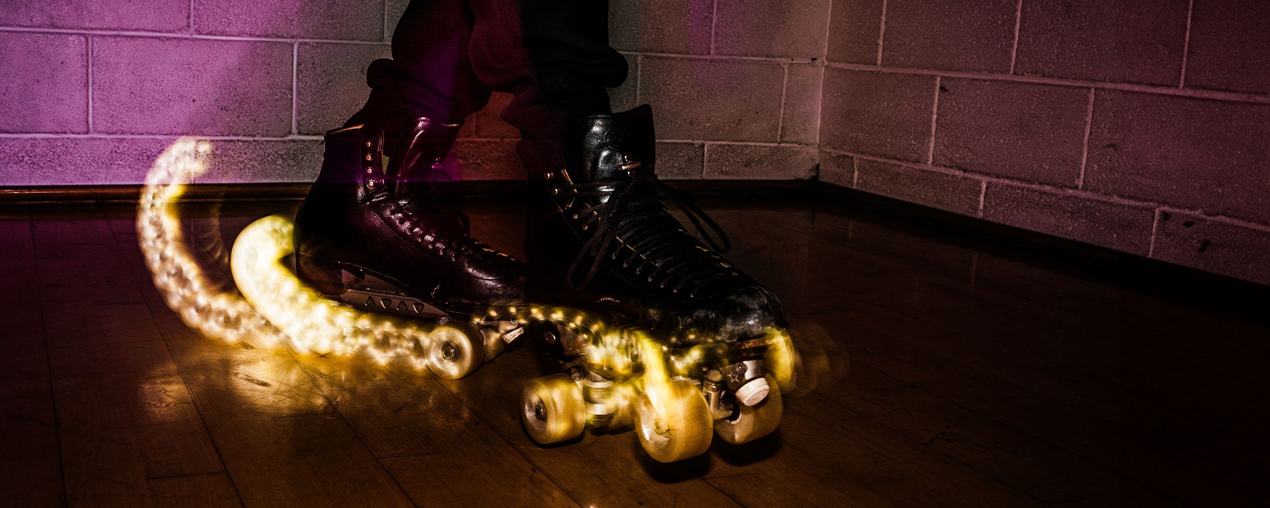 Bont Glow light up wheels on Riedell 336 roller skates. Shot using a slow shutter speed to create motion blur. Picture by Roland Ramanan