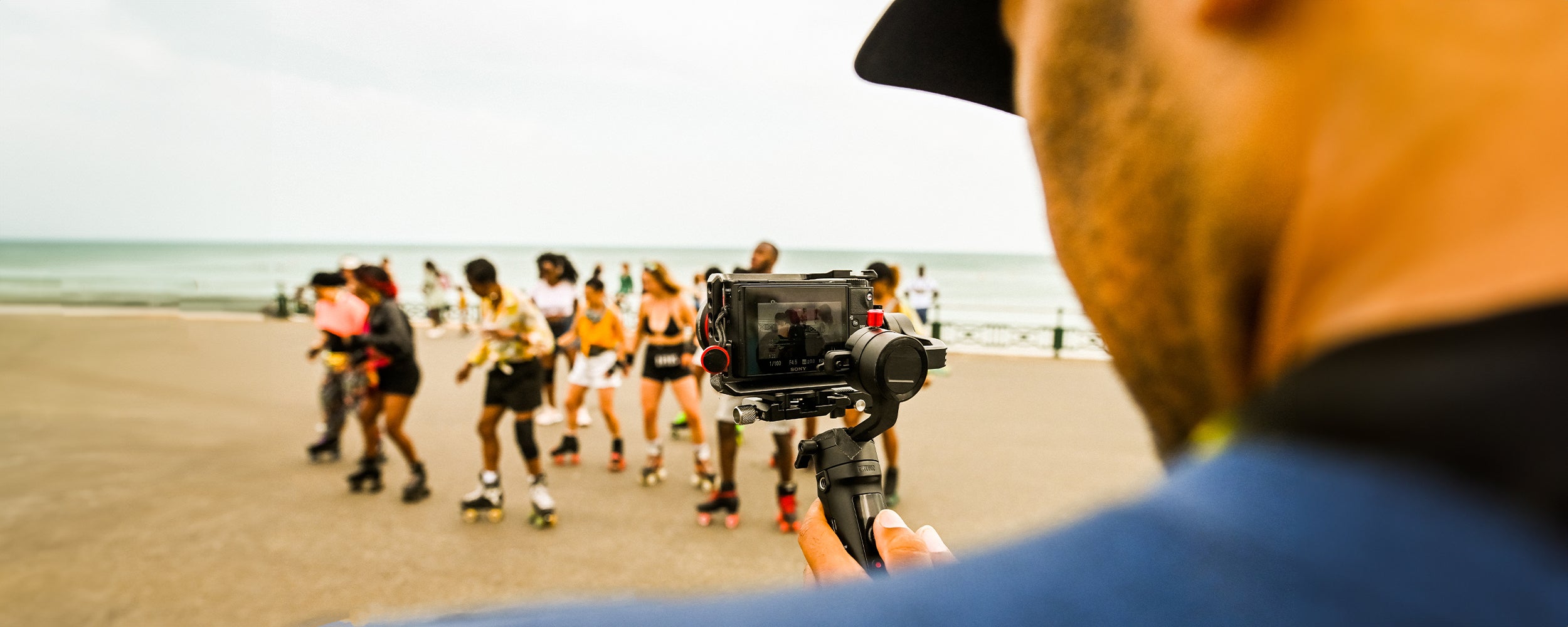 Mellow Moves filming the Burgess Park Roller Skate Community doing a skate dance routine during their day trip to Brighton Beach in the summer.